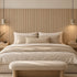 Bedroom with a headboard wall in the natural oak Mini slat SuperFlex flexible panel