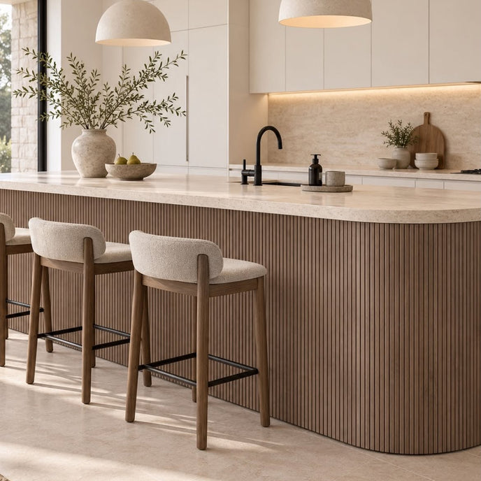 Rounded kitchen island covered in the walnut Mini slat SuperFlex flexible panel