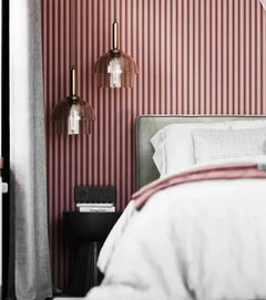 Linéapur Drum PVC wall panels painted powder pink behind a headboard